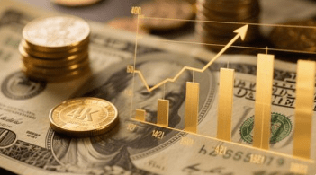 Close-up of cash, coins, and graphs representing interest growth.